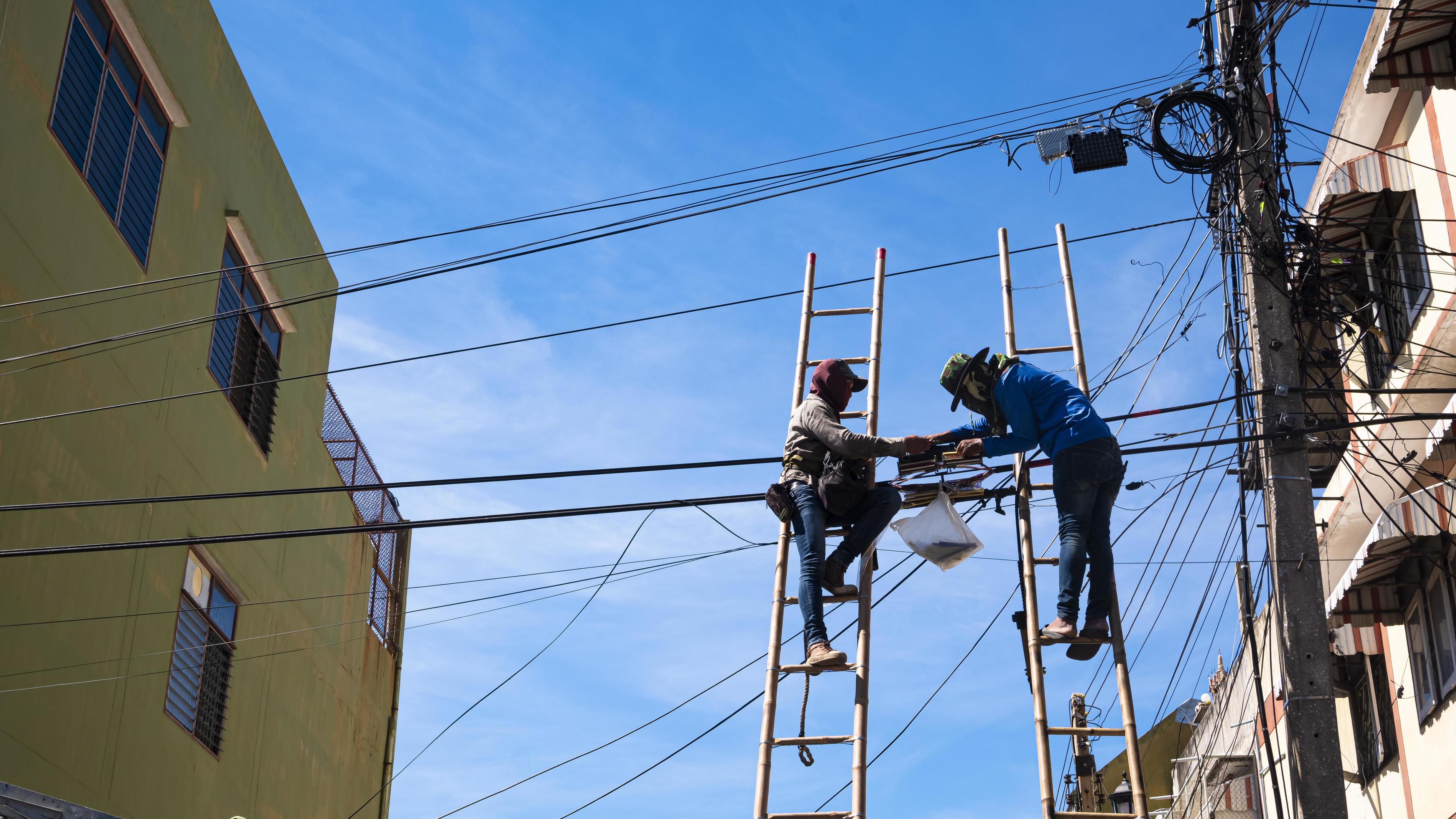 Technicians Installing Telephone Lines