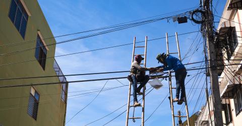 Technicians Installing Telephone Lines